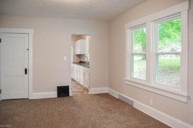Formal dining room with new carpet.