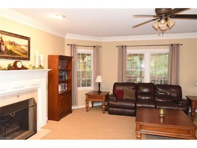 The family room is warmed by a comforting fireplac