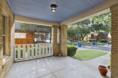 Porch with a baseboard heating unit and a residential view