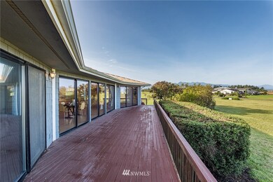 Deck on west side of main cottage pointed toward the gorgeous saltwater view and SUNSETS!