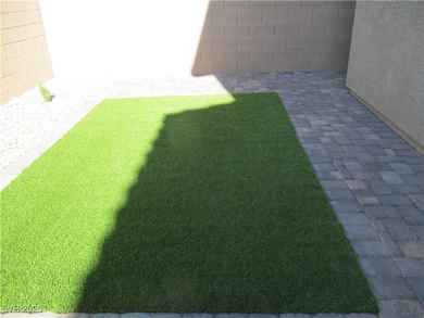 View of yard with a patio and fence
