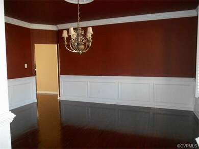 The dining room is outlined by two columns and boa