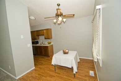 Wood laminate in kitchen and eating area.