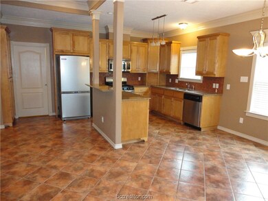 Kitchen with granite countertops, backsplash, 5 bu