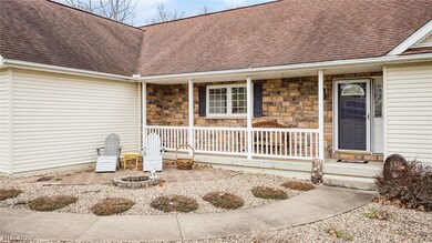 Doorway to property featuring a porch