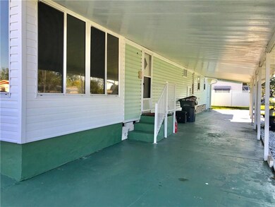 3 Car Carport with circular drive