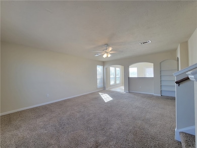 Unfurnished living room with ceiling fan, light ca