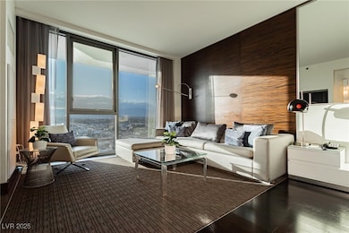 Living area with hardwood / wood-style floors