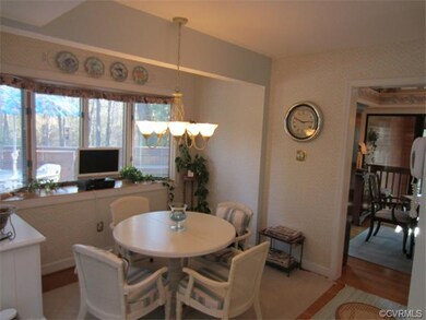 Breakfast area, bay window, hardwood flooring!