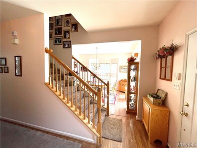 welcoming foyer with laminate hardwood