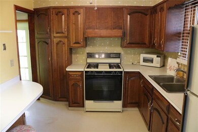 The 11' X 9' Kitchen features Opulent Cherry Cabin