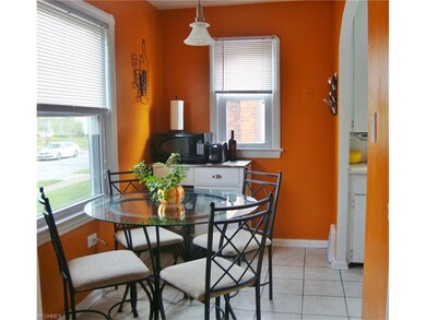 Cheerful dinette area with ceramic tiled flooring.