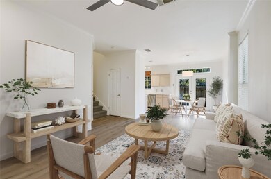 Living room with crown molding, ceiling fan, ligh