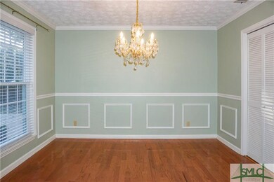 Formal Dining Room with Wainscoting and elegant ch