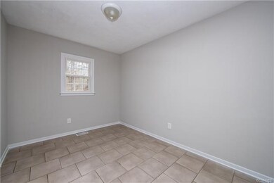 tiled dining room adjoining living room