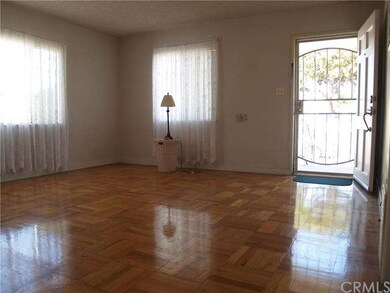 The Living room has Laminate wood flooring.