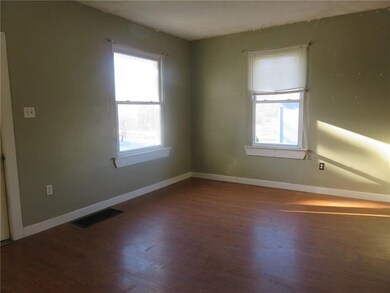 The large living room has laminate flooring