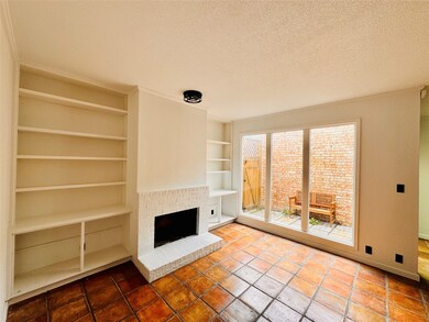 Wood burning fireplace and freshly painted shelves