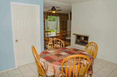 Kitchen and Dining Combo with unique double fireplace  which opens to kitchen and living room.