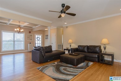 Living room opens to foyer and dining room. Hardwo