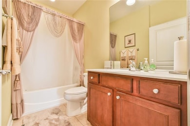 Full bathroom with shower / bath combo with shower