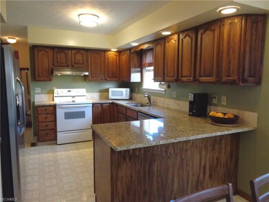 View #1 of the kitchen w/granite counter tops, ran