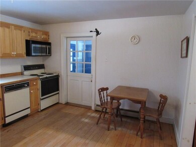 Eat-in kitchen connects to entry...