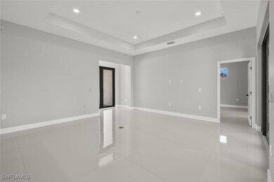 Empty room with visible vents, baseboards, a raise