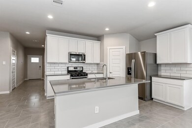 Gourmet Kitchen has Beautiful Tall Shaker Cabinets