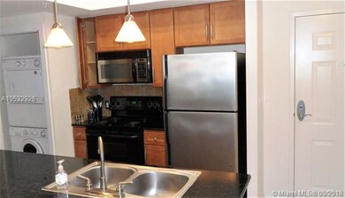 Modern open kitchen with newer W/D.
