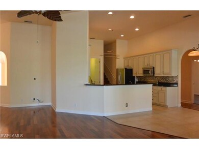 VIEW OF KITCHEN AND LIVING ROOM FROM LANAI