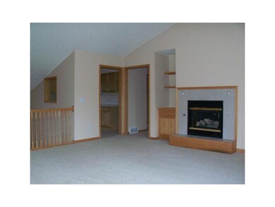 Living Room. Gas Fireplace and brand new carpet