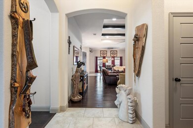 Hallway with light hardwood / wood-style flooring