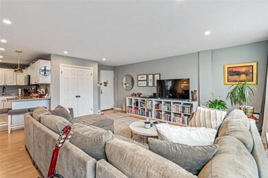 Living Room with Smooth Ceilings and Hi-Hats.