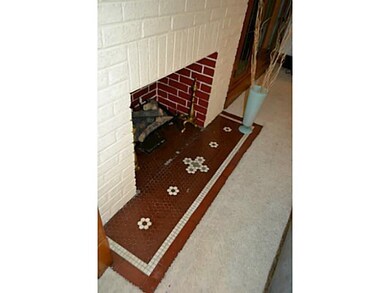 Living Room. Original tile work in front of gas fi
