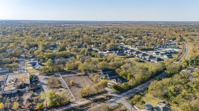 Aerial overview of property's location featuring nearby suburban area