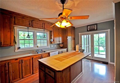 Kitchen with door to screened in back porch
