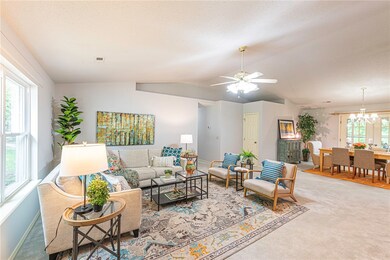 Spacious living room with vaulted ceilings and fre