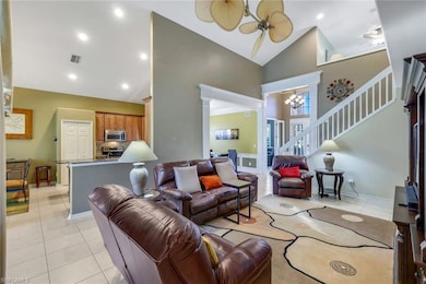 Grand room featuring fan-a-mation fan, high vaulte