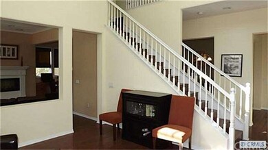 Elegant living showcases volume ceiling and tons o