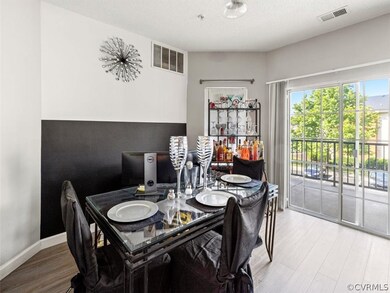The dining room with LVP floors is open to the fam