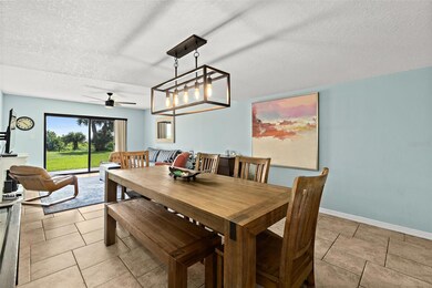 Dining room with beautiful light fixture.
