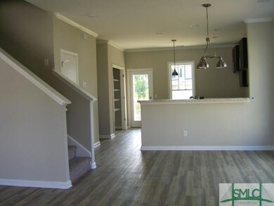 VIEW FROM FRONT ENTRY OF DINING ROOM, KITCHEN WITH