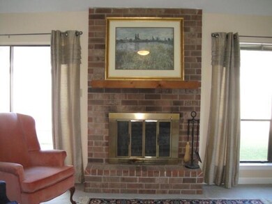NICE BRICK FIREPLACE IN DEN