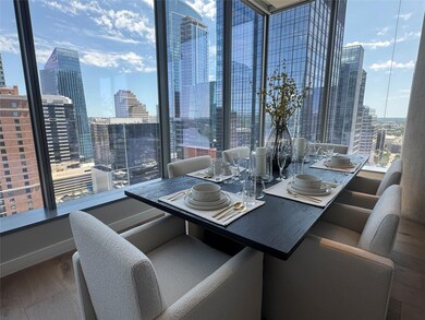 Dining space with a city view and wood finished f