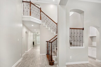 As you entry the foyer, the formal dining room to the right which has 2 way access leading into the Butler's pantry!