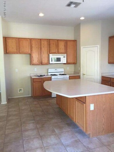 Lots of kitchen cabinets and large islan