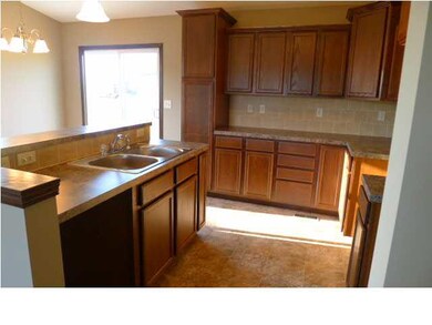 KITCHEN WITH PANTRY CABINET AND COMES WITH DISHWAS