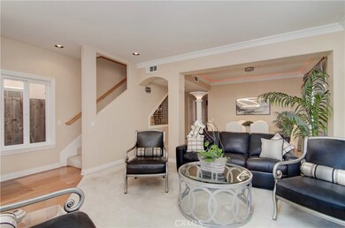 Elegant style includes nice architectural elements, crown moldings and lux carpets in the formal living room.