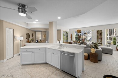 Kitchen with dishwasher, a sink, open floor plan,